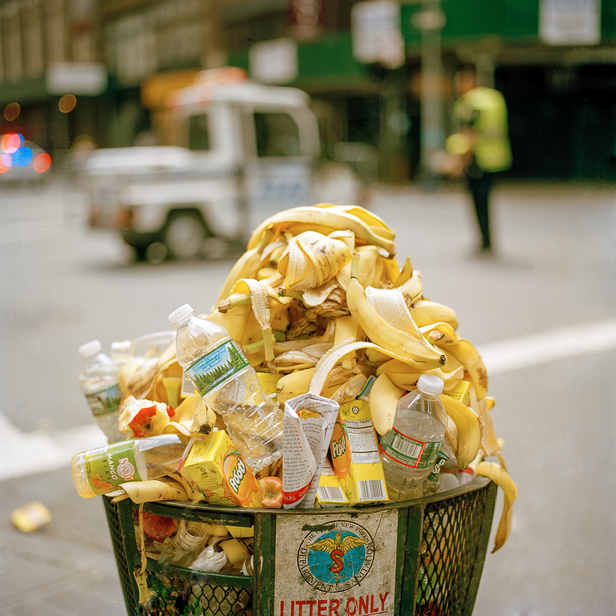 A pile of banana skins sits in a New York City Trash can in Midtown East