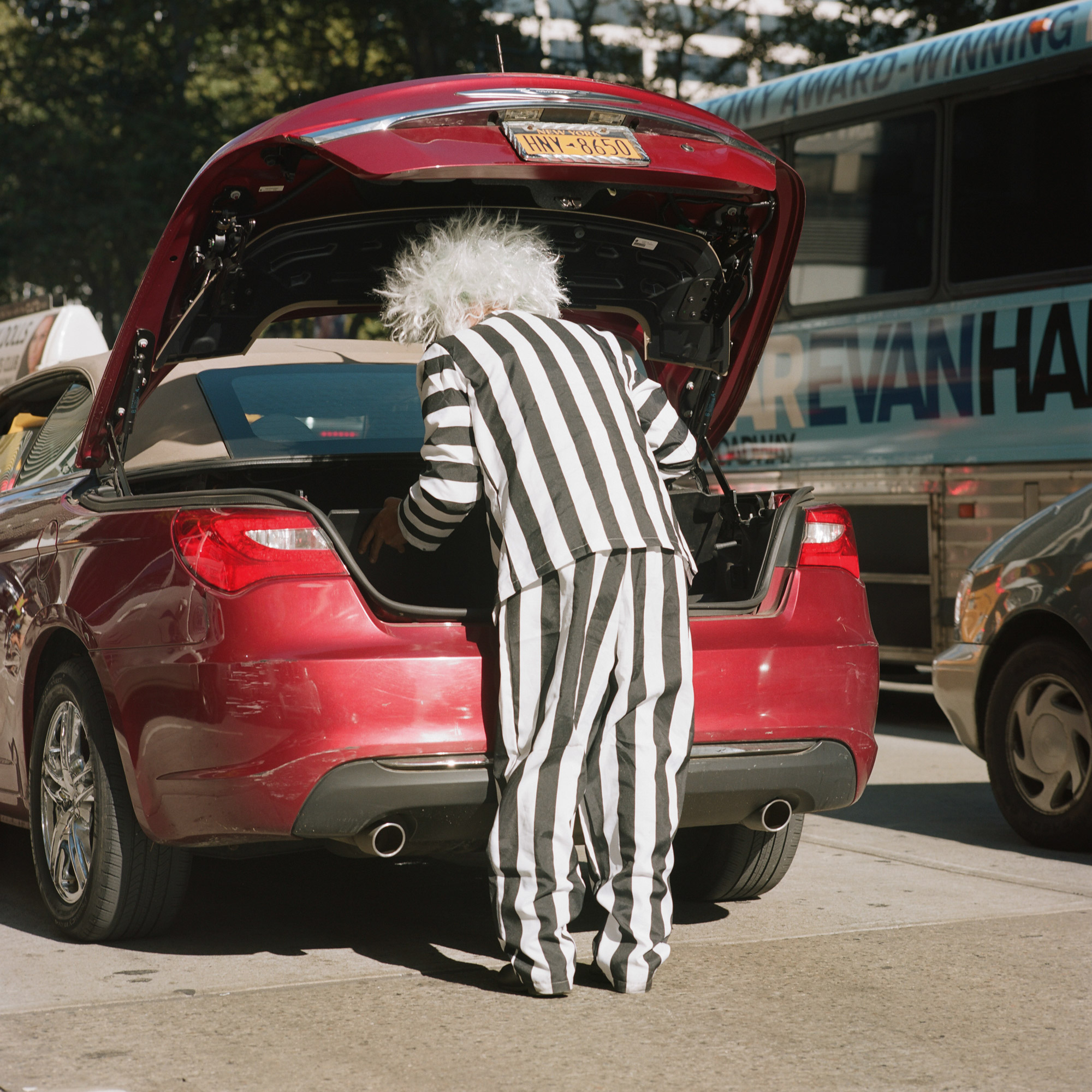 A-MAN-DRESSED-AS-BEETLEJUICE-GRABS-SOMETHING-OUT-OF-HIS-CAR-IN-MANHATTAN-NEW-YORK-