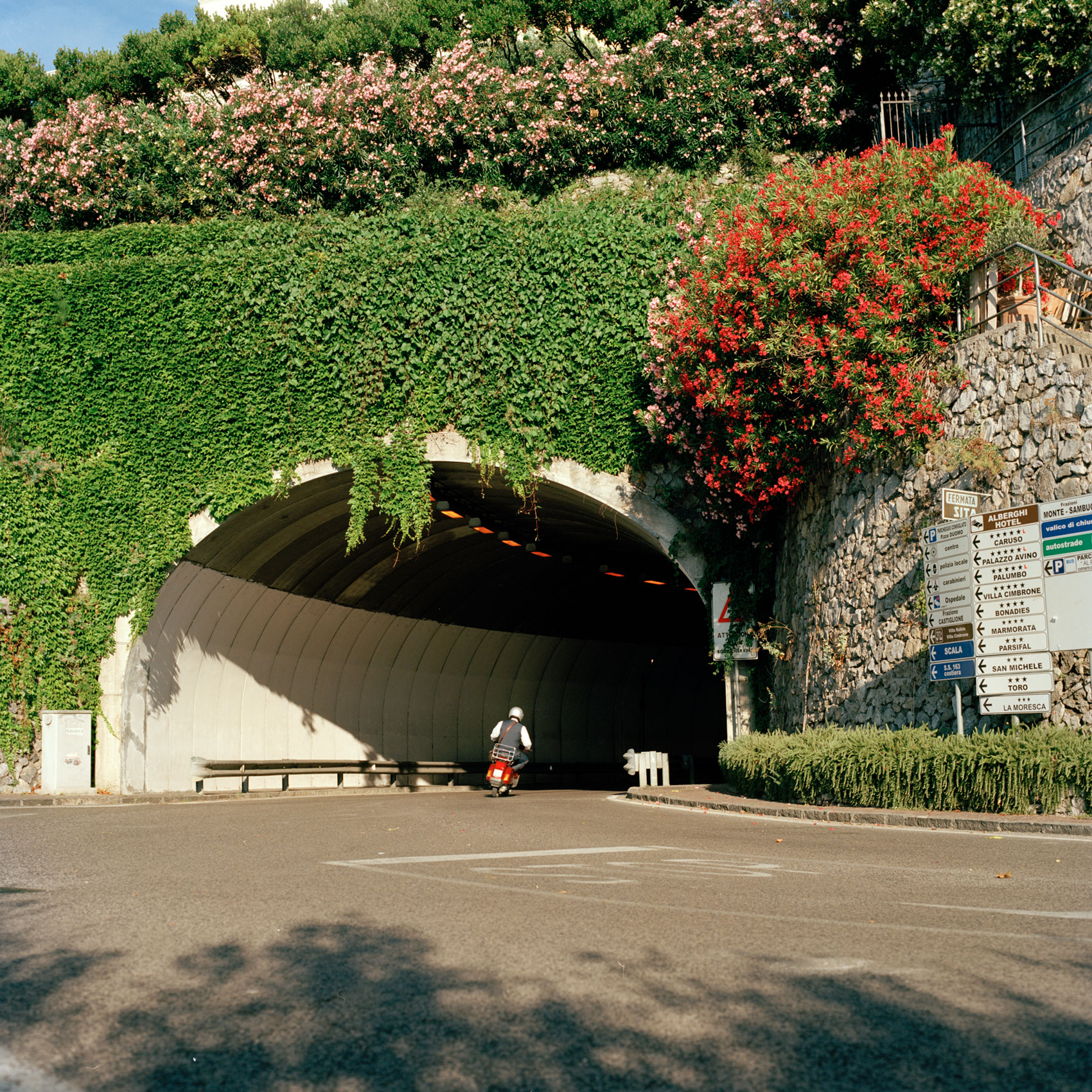 A-MAN-ON-A-CESPA-DRIVES-THROUGH-A-TUNNEL-IN-SOUTH-ITALY