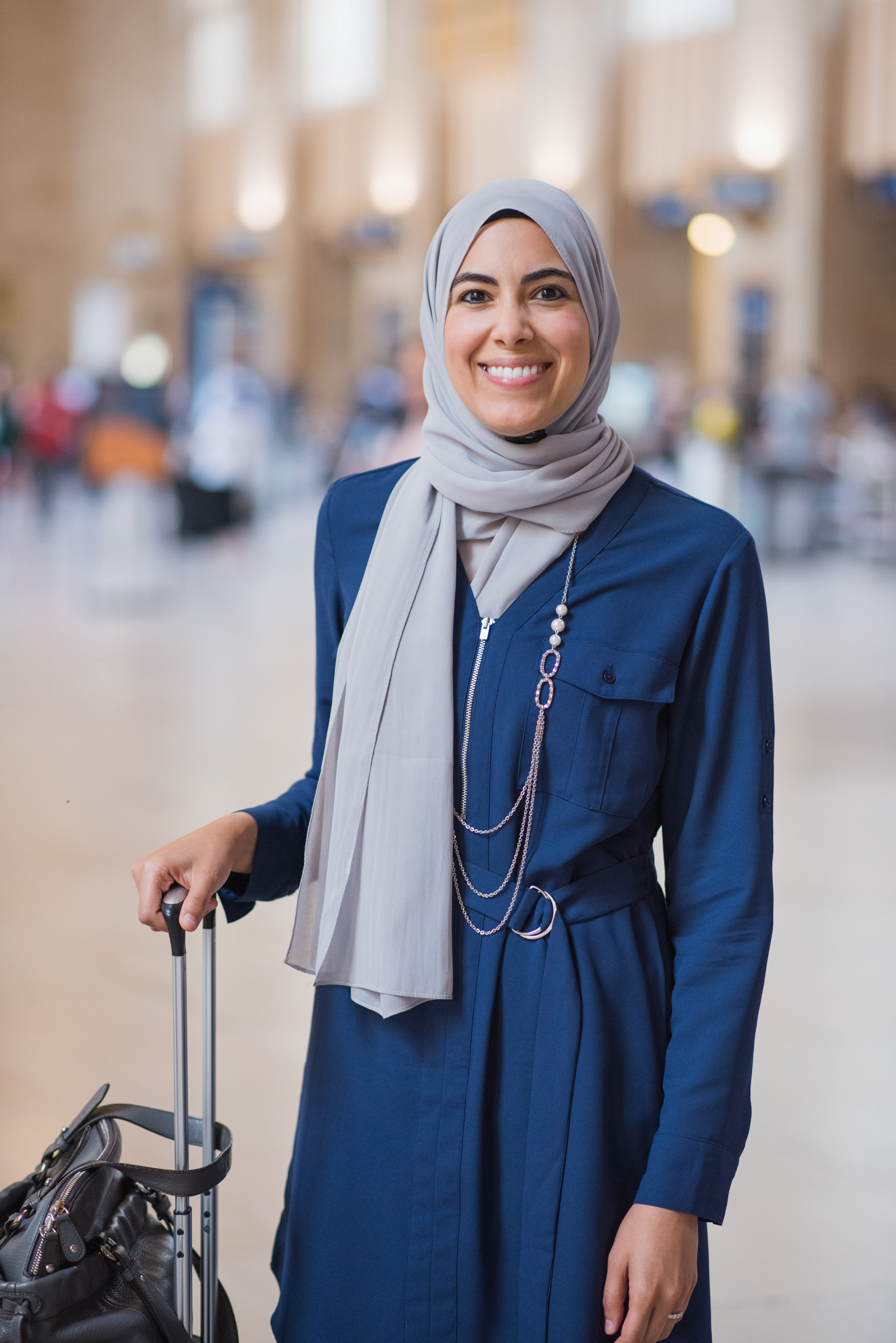 A-PASSENGER-POSES-WITH-HER-SUITCASE-FOR-THE-AMTRAK-MAGAZINE-THE-NATIONAL-IN-PHILADELPHIA-TRAIN-STATION