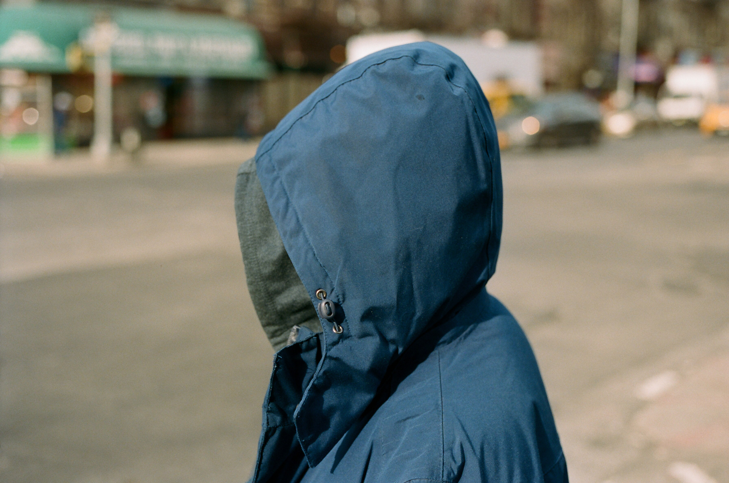 A-SIDE-PROFILE-OF--MAN-IN-A-HOOD-IN-NEW-YORK-CITY-