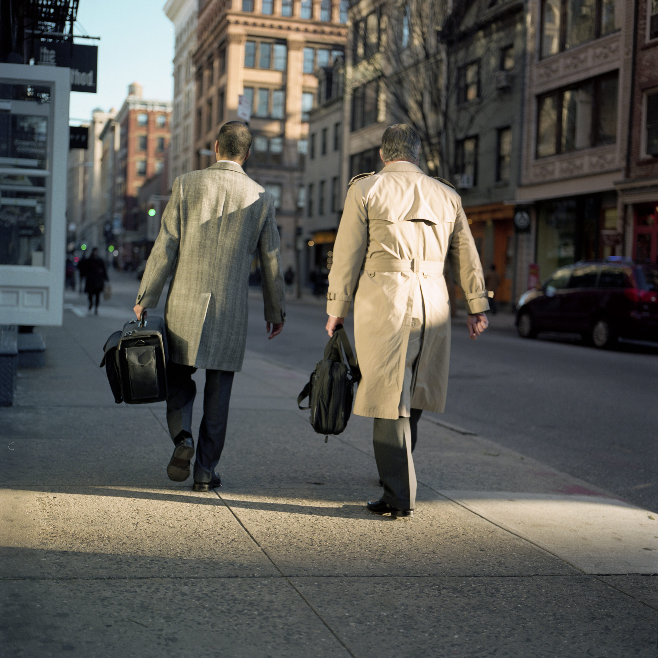 TWO SUITED MEN IN SOHO