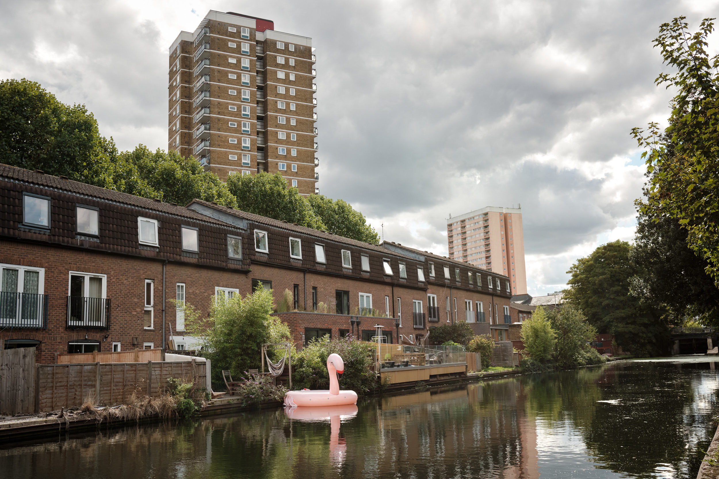 A FLAMINGO FLOATS ON THE REGENTS CANAL IN LONDON ENGLAND