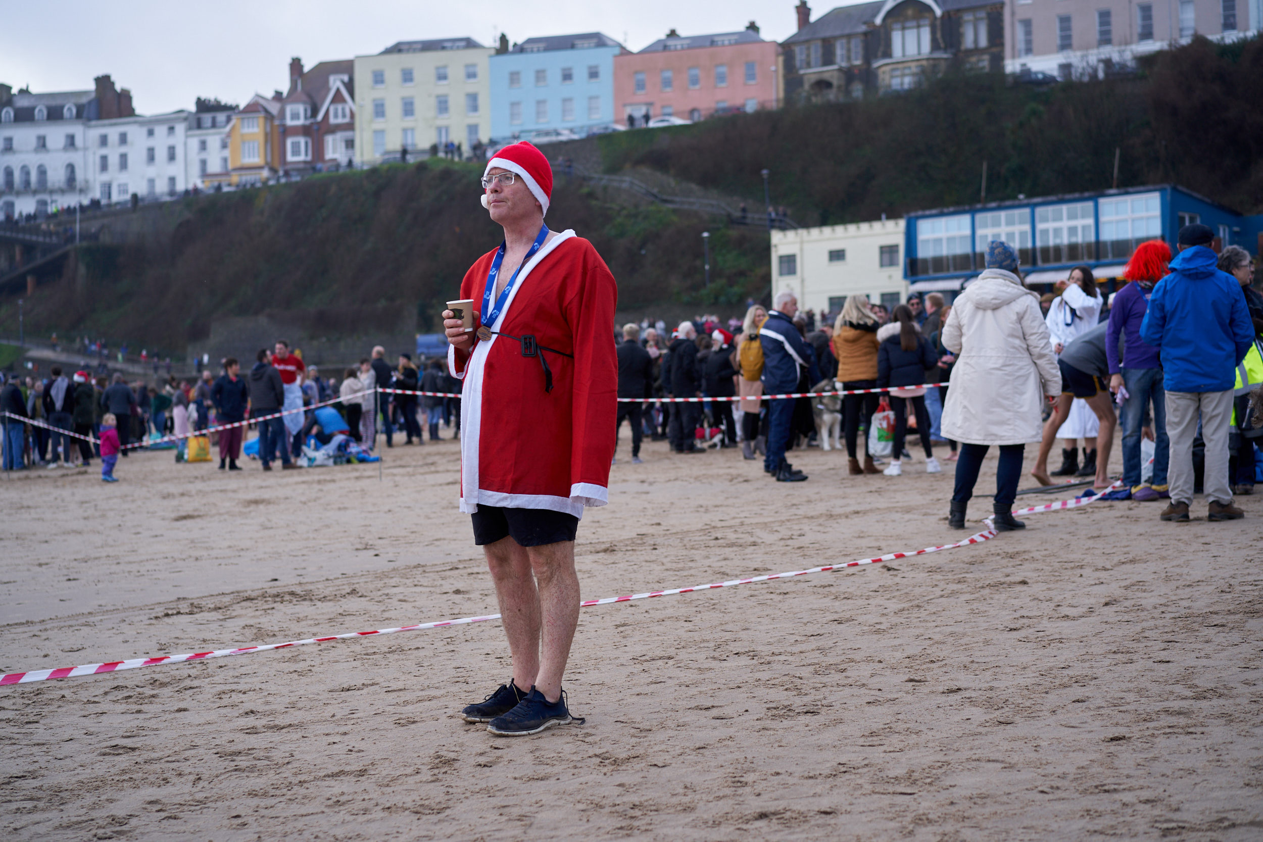 A MAN DRESSED IN A SANTA COSTUME FROM THE TENBY BOXING DAY SWIM