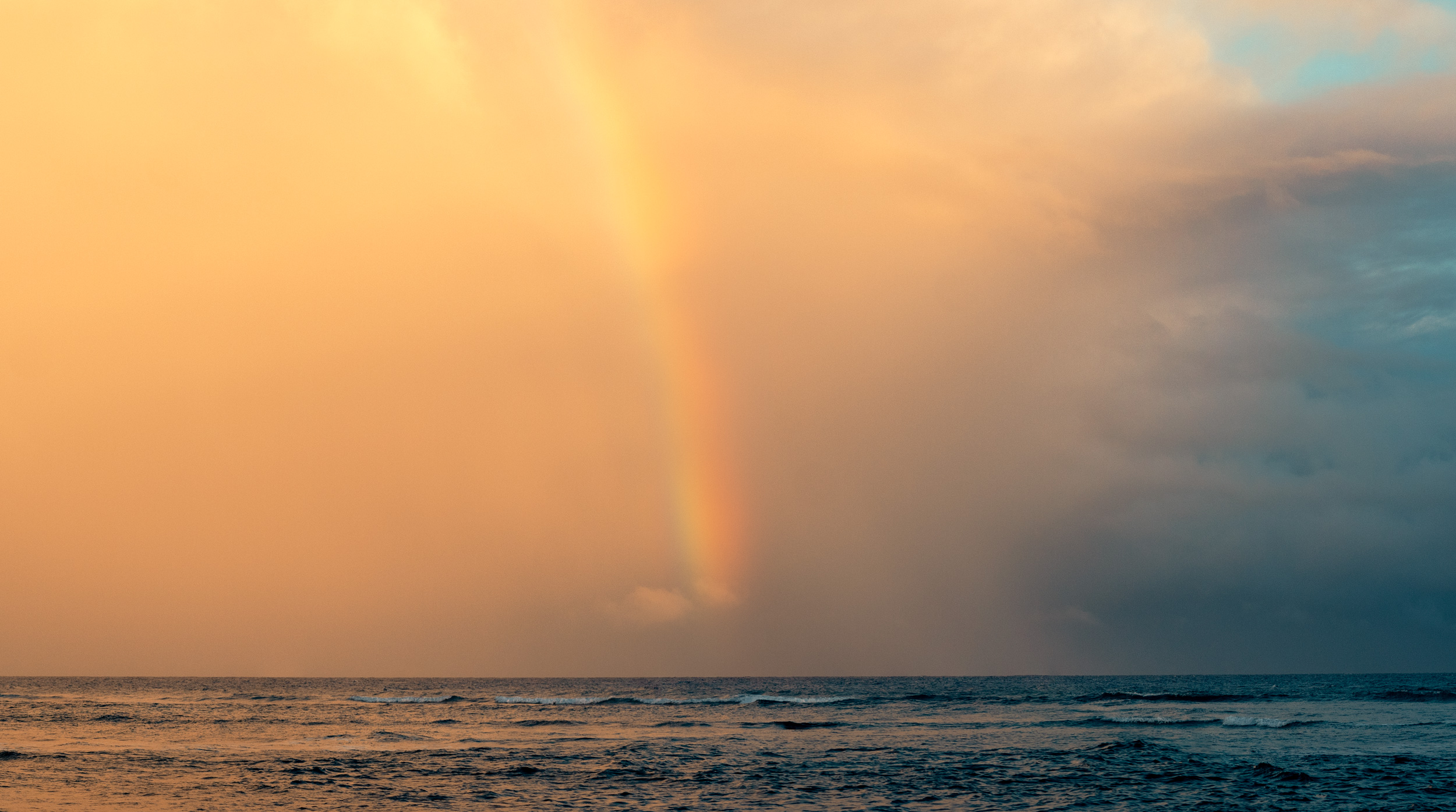 AN-EARLY-MORNING-SUNRISE-BREAKING-THROUGH-A-RAINSTORM-WITH-RAINBOW-IN-VIEQUES-PEURTO-RICO