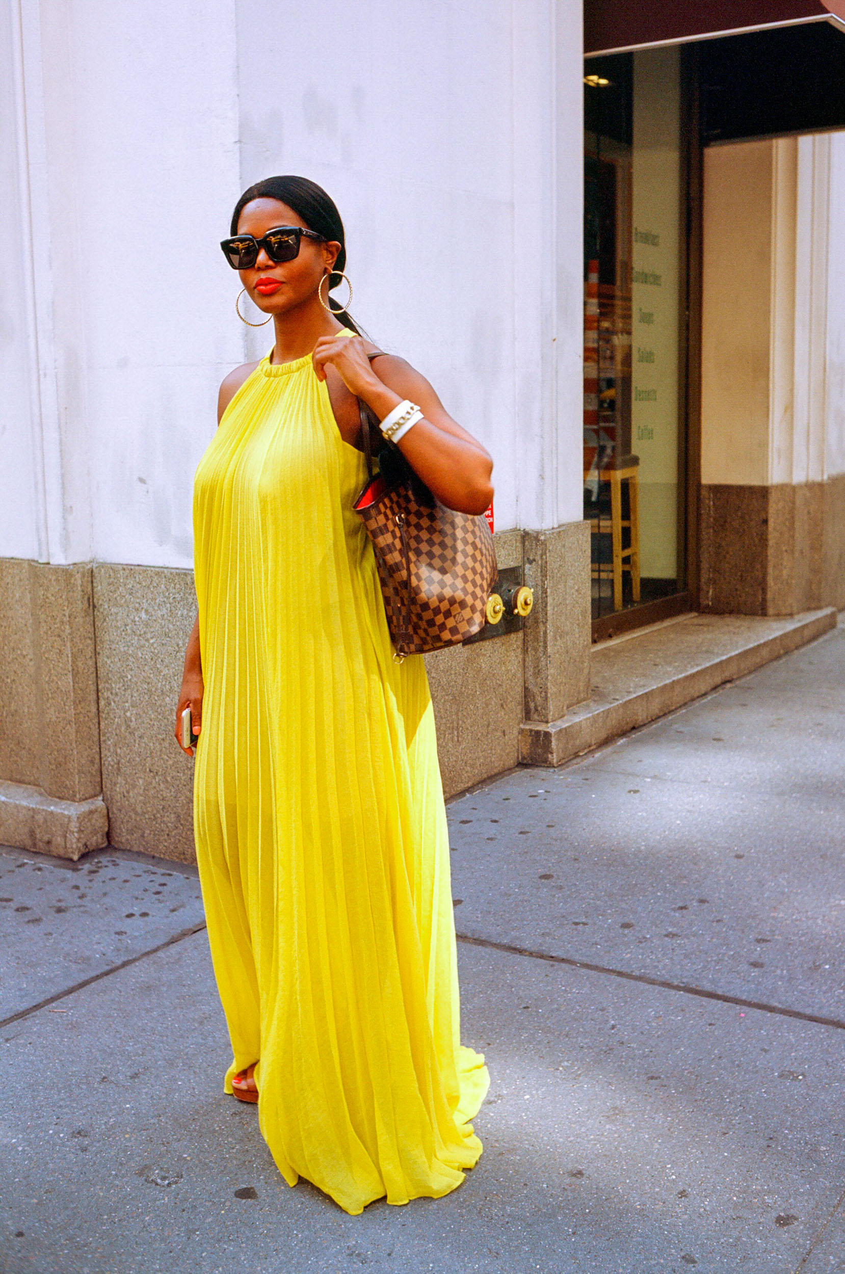 A-STREET-PORTRAIT-OF-A-WOMAN-IN-A-YELLOW-DRESS-IN-NEW-YORK-CITY