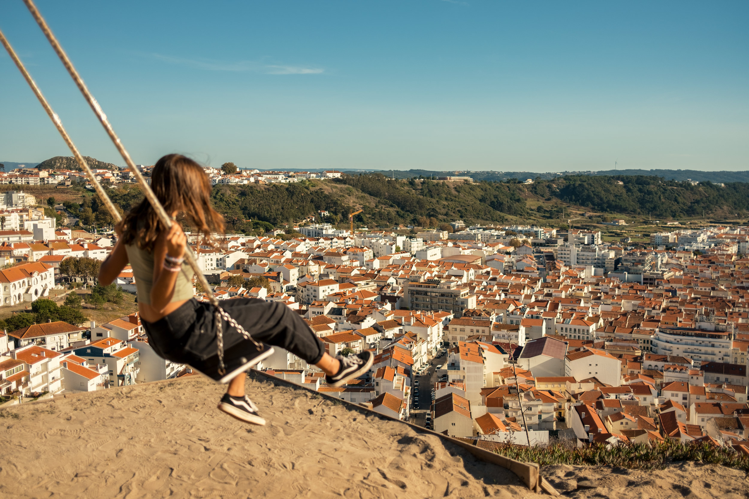 A-GIRL-SWINGS-OVER-THE-TOWN-OF-NAZARE