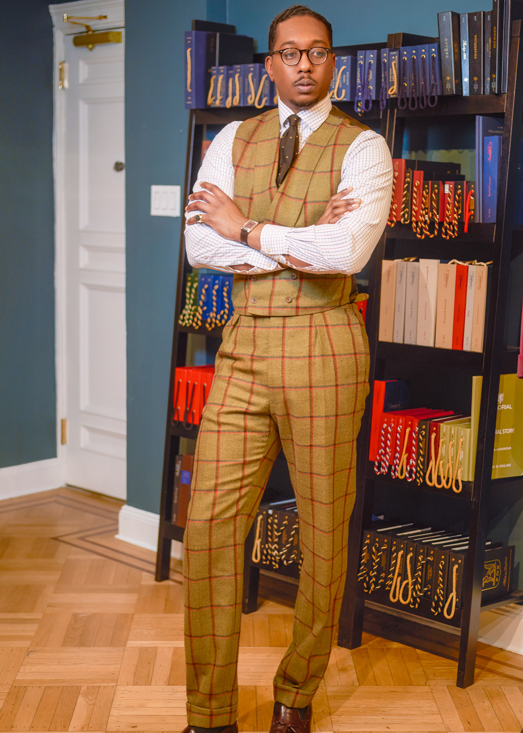 JASON POSES IN THE SHOWROOM IN HIS BEAUTIFUL BESPOKE SUIT AT CAD AND THE DANDY IN NEW YORK CITY