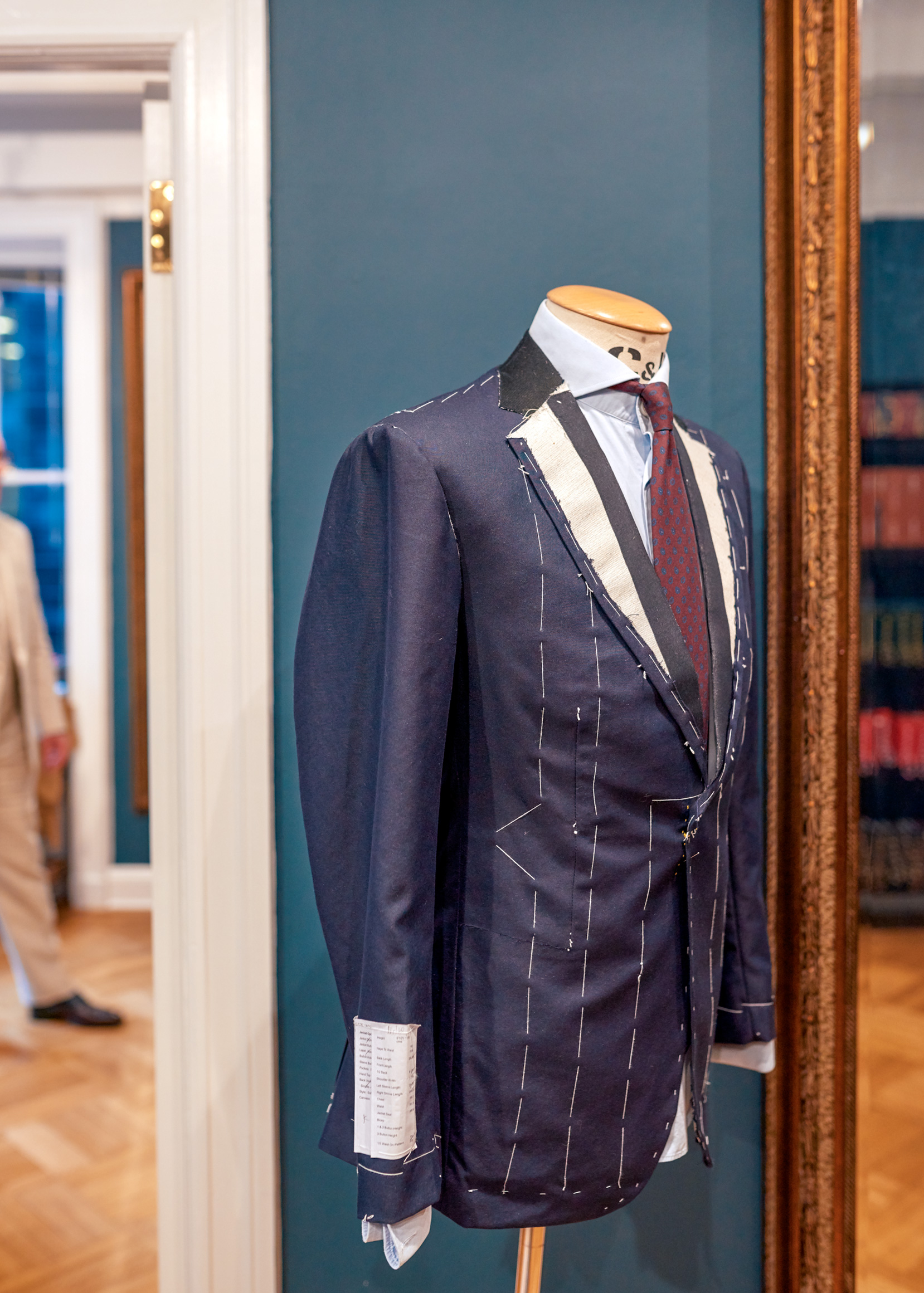 A SHOT OF A MANNEQUIN DONNING THE OUTFIT OF LAYERS OF A SUIT