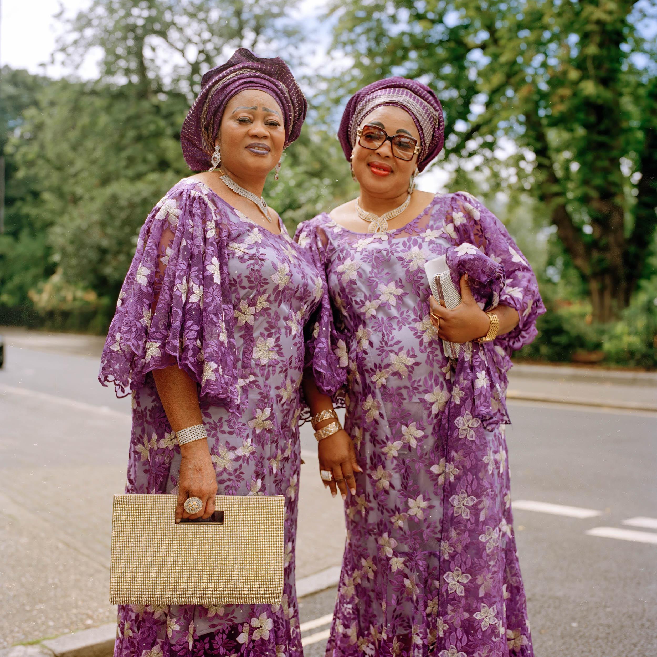 PORTRAIT OF TWO  WOMEN ON THEIR WAY TO CHURCH  IN NORTH LONDON