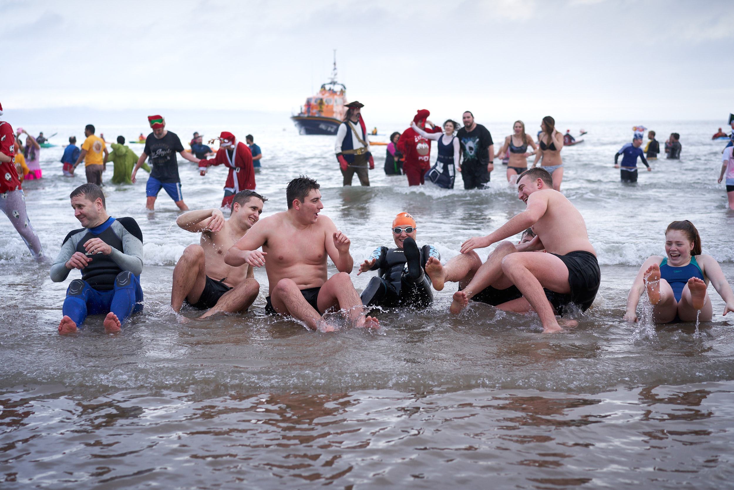 PARTICIPANTS POSE FOR A PHOTO DURING THE TENBY BOXING DAY SWIM