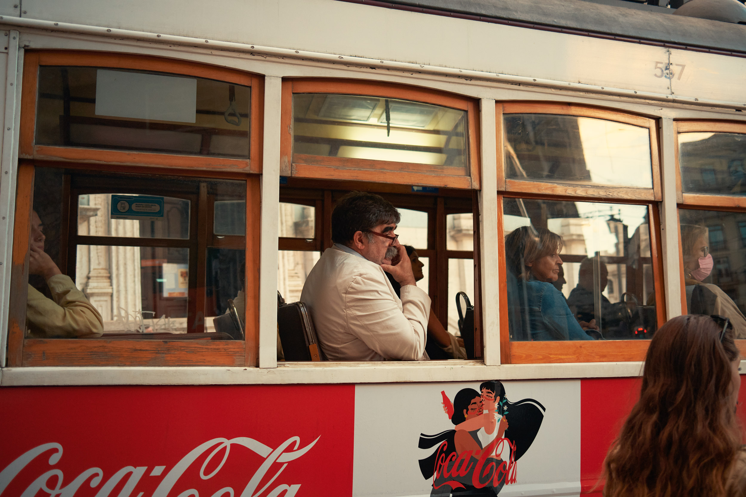 TOURISTS-SIT-ON-A-TRAM-IN-LISBON-PORTUGAL